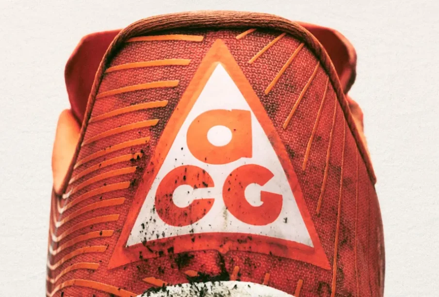 Nike Inc. has officially relaunched its All Conditions Gear (ACG) line as a standalone outdoor performance brand, signalling a strategic shift to deepen its presence in technical trail and outdoor markets. The move includes a renewed focus on trail running, hiking, exploration and other outdoor pursuits, and coincides with plans to open the first ACG-dedicated retail space — the ACG Base Camp — in Beijing’s Taikoo Li Sanlitun shopping district this month. ACG, originally launched in 1989, has a four-decade history as Nike’s specialist label for rugged, performance-oriented gear built to endure diverse environments. After periods of limited activity in recent years, the refreshed ACG reintegrates Nike’s Nike Trail product line and expands its mission to focus squarely on athletes and outdoor enthusiasts who demand gear capable of handling “all conditions.” Outdoor Performance at the Forefront Under the reimagined strategy, ACG’s product range emphasises high-performance footwear and apparel designed for off-road environments. Key offerings include updated trail shoes such as the ACG Ultrafly and ACG Zegama, as well as purpose-built apparel like technical tops and insulated jackets engineered to withstand extreme weather and terrain challenges. Nike has also expanded the All Conditions Racing Department, a collective of elite trail and outdoor athletes who will help shape future product development through real-world testing and performance feedback. Beijing’s ACG Base Camp: More Than Just a Store The first dedicated ACG retail space — dubbed ACG Base Camp — is scheduled to open this month in Taikoo Li Sanlitun, a vibrant Beijing shopping and cultural destination. Far beyond a traditional shop, Nike markets the Base Camp as a “physical manifesto” of the brand’s ethos — a space where community, exploration and gear innovation converge. Nike intends for the Base Camp to act as a hub for the brand’s outdoor narrative, offering immersive experiences and serving as a focal point for trail athletes and outdoor enthusiasts. The concept is expected to evolve over time, with additional activations planned at select Nike stores worldwide. Strategic Context and Industry Impact The ACG relaunch comes amid Nike’s broader “Sports Offense” strategy, which aims to sharpen its focus on core sports performance and reinvigorate sub-brands with meaningful identities that resonate with specialised athlete communities. By consolidating trail and outdoor performance under the ACG banner, Nike looks to compete more directly with established outdoor brands while reinforcing its technical innovation narrative. Analysts see the decision as part of Nike’s efforts to reinvigorate growth in categories that blend lifestyle appeal with authentic athletic performance — and to deepen engagement in key regions, particularly Asia, where outdoor sports participation and premium gear demand have been rising.