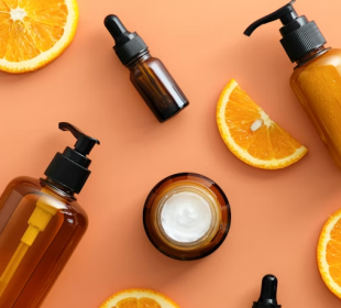 slices of citrus fruit and vitamin c serum