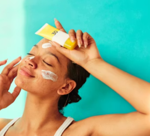 a model holding a sunscreen