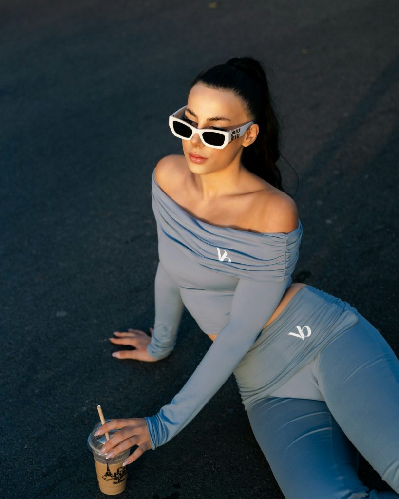 a model on an athleisure style with a matching long sleeve fitted sport top