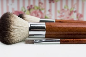 a pair of makeup brushes