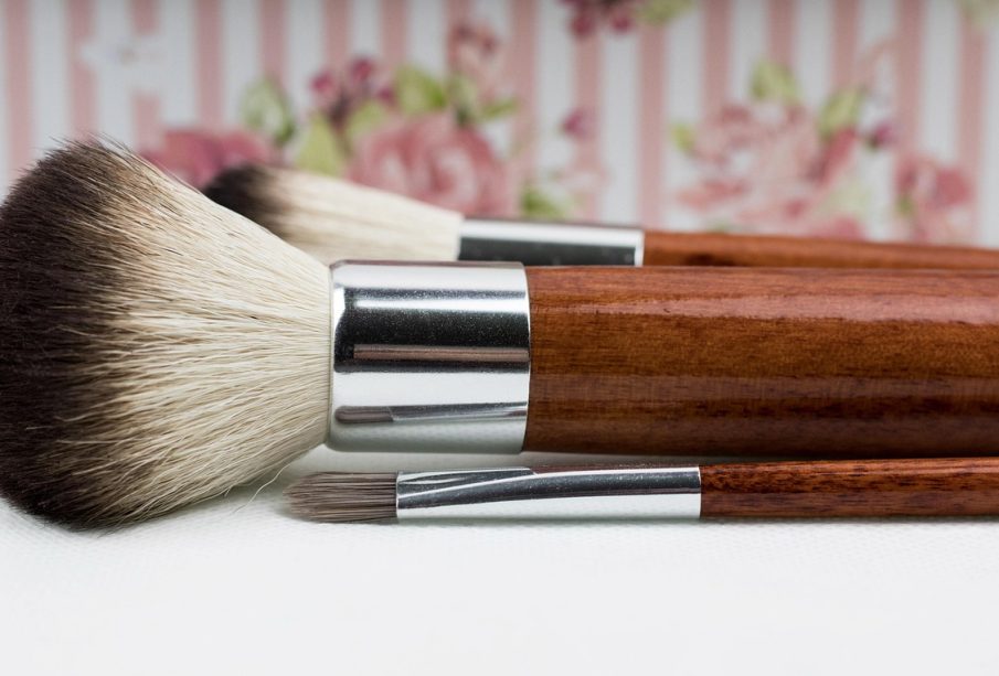a pair of makeup brushes