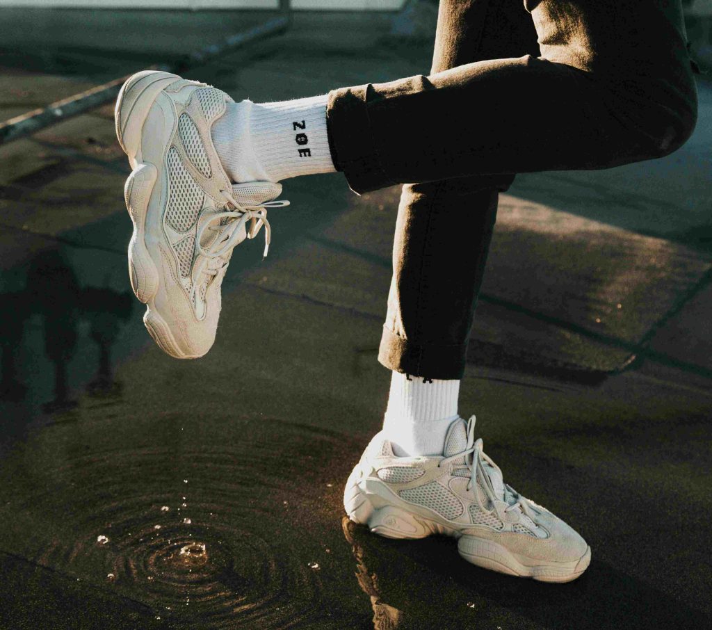 a model wearing fashion sneakers