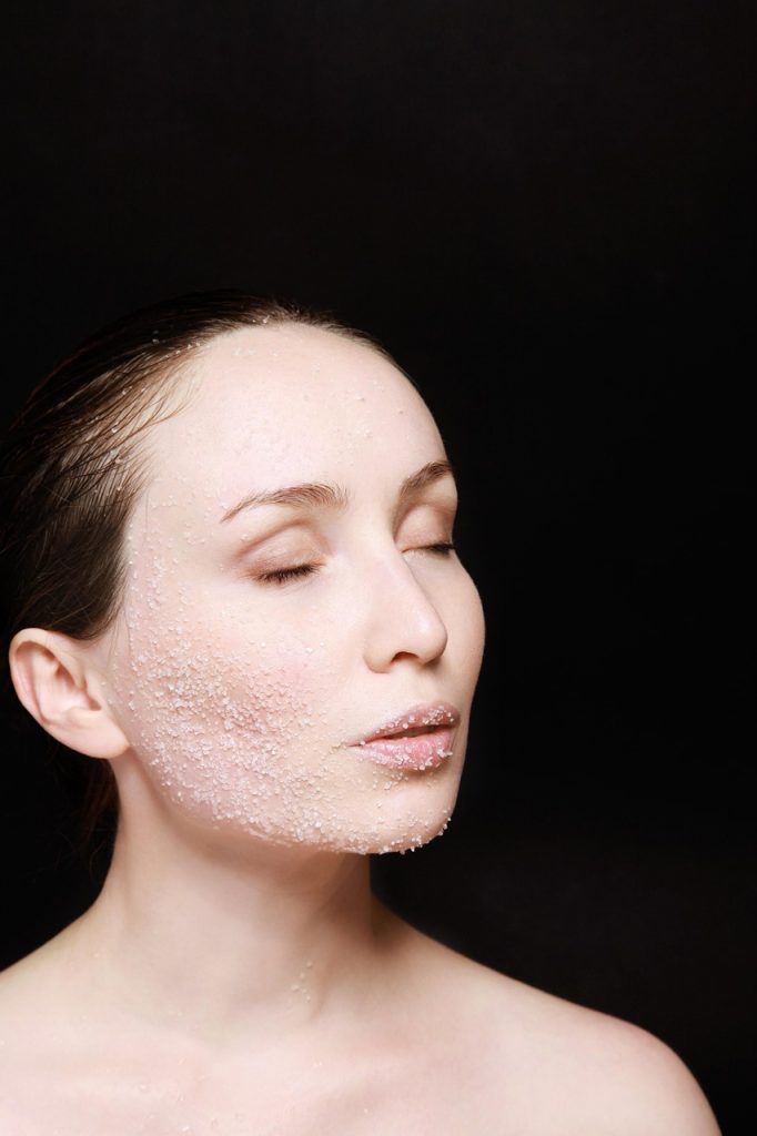 woman applied exfoliant on face