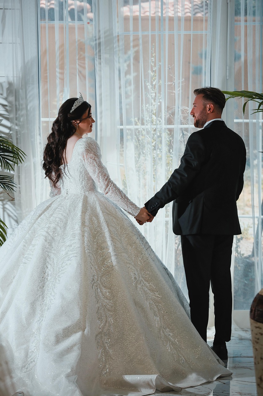 a bride on a waist defining wedding gown
