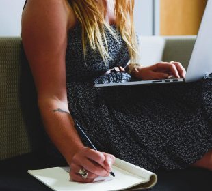 a lady working at home on the couch