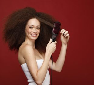 a model combing her natural hair