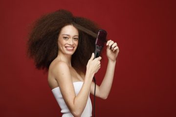 a model combing her natural hair