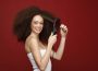 a model combing her natural hair