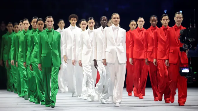 a picture of models on the Armani suit at the winter olympics opening ceremony